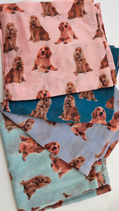 Four scarves with tan cocker spaniel dog pattern on a white background