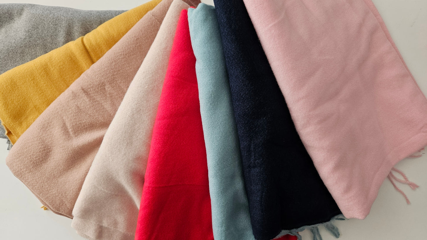 Selection of Super Soft pashminas in 8 colours on white background 