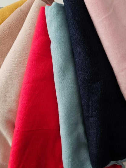 Selection of Super Soft pashminas in 8 colours on white background 