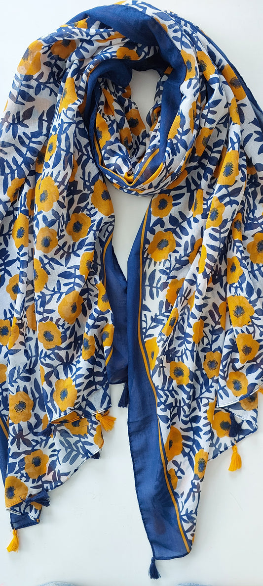 Blue and yellow floral patterned scarf with tassels on a white background