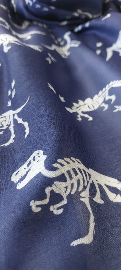 Navy blue scarf with white t-rex dinosaur skeleton patterns