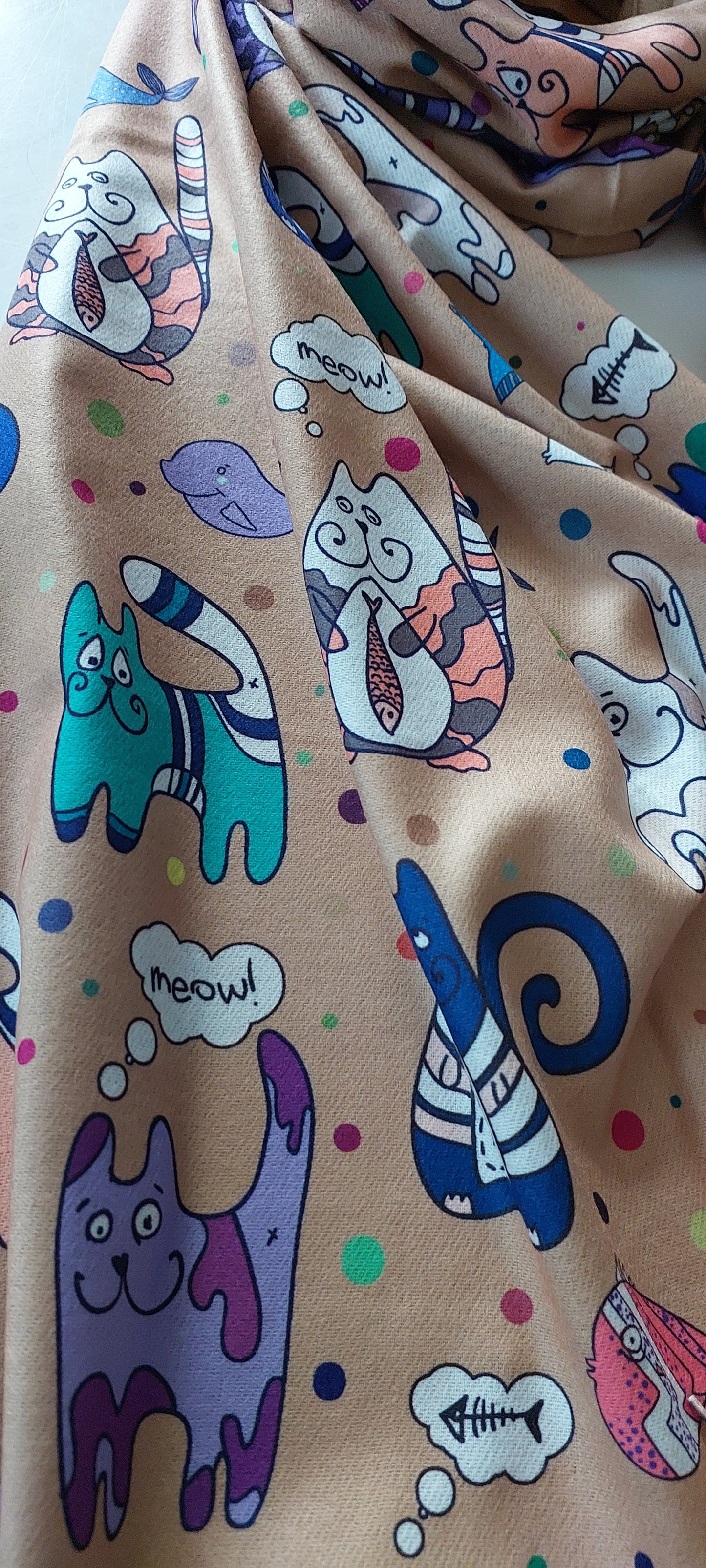 Pashmina with colourful cat illustrations and polka dots on a taupe background