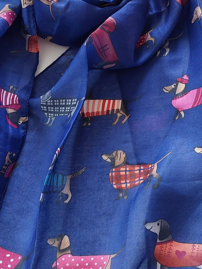 Blue scarf with cartoon sausage dog pattern on a white background