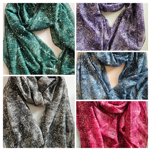 Collage of glittery scarves in various colours on a white background